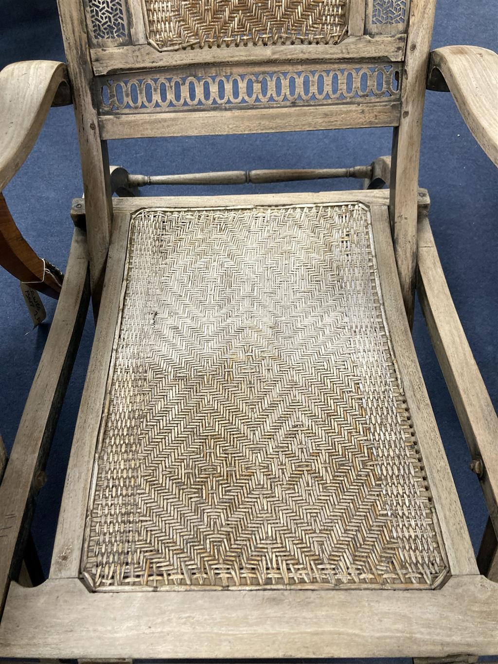 An Anglo Indian caned bleached hardwood steamer chair